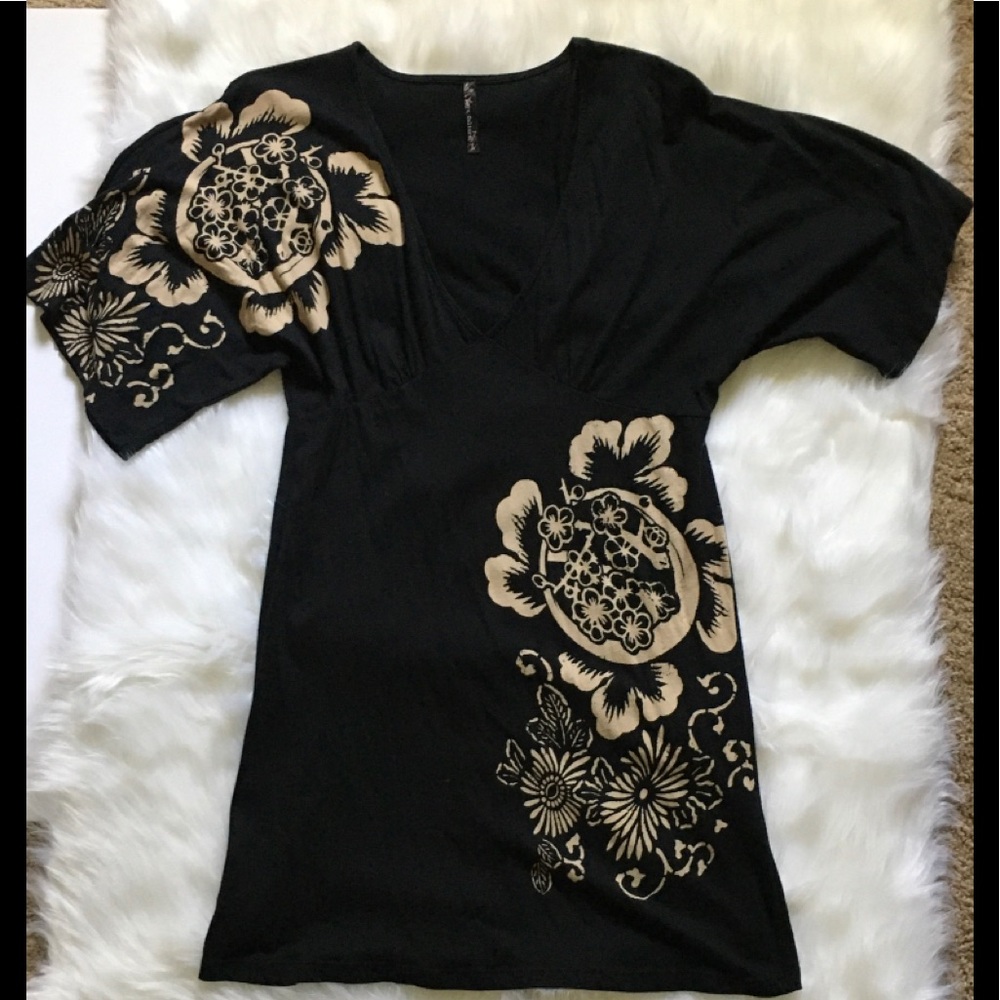 Black mini dress with beige floral print